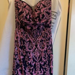 This dress is a Sherri Hill size 12.